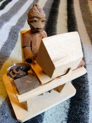 carved wooden computer and worker